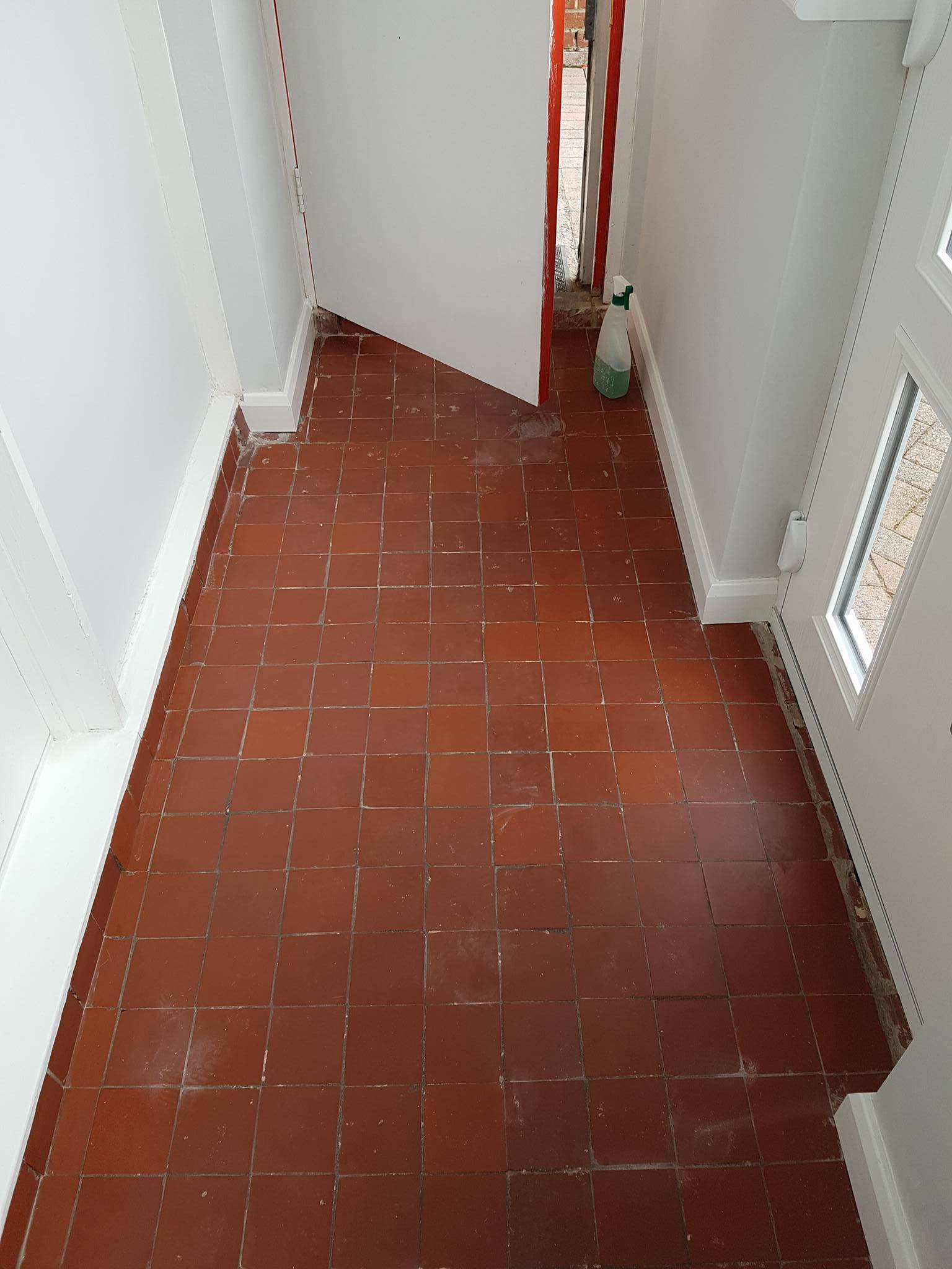 Quarry tiled porch before cleaning